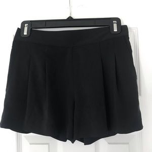 Black pleated shorts